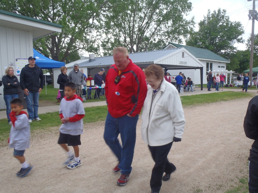 Jim Epp accompanies his mother, JoAnn Epp, as they walk around the 'track'.