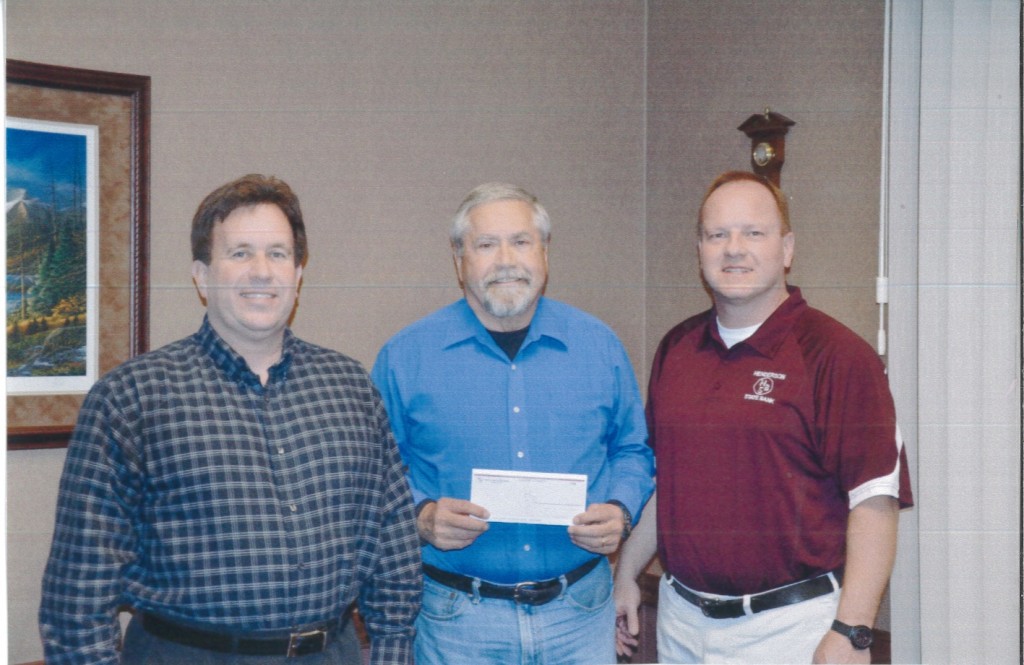 Kevin Postier and JB Suddarth with Henderson State Bank presenting the Henderson Community Foundation President, Norm Yoder, with a check for $12,500 for the Henderson Community Foundation Scholarship Endowment.  This is the first instalment of a $25,000 donation by Henderson State Bank. 
